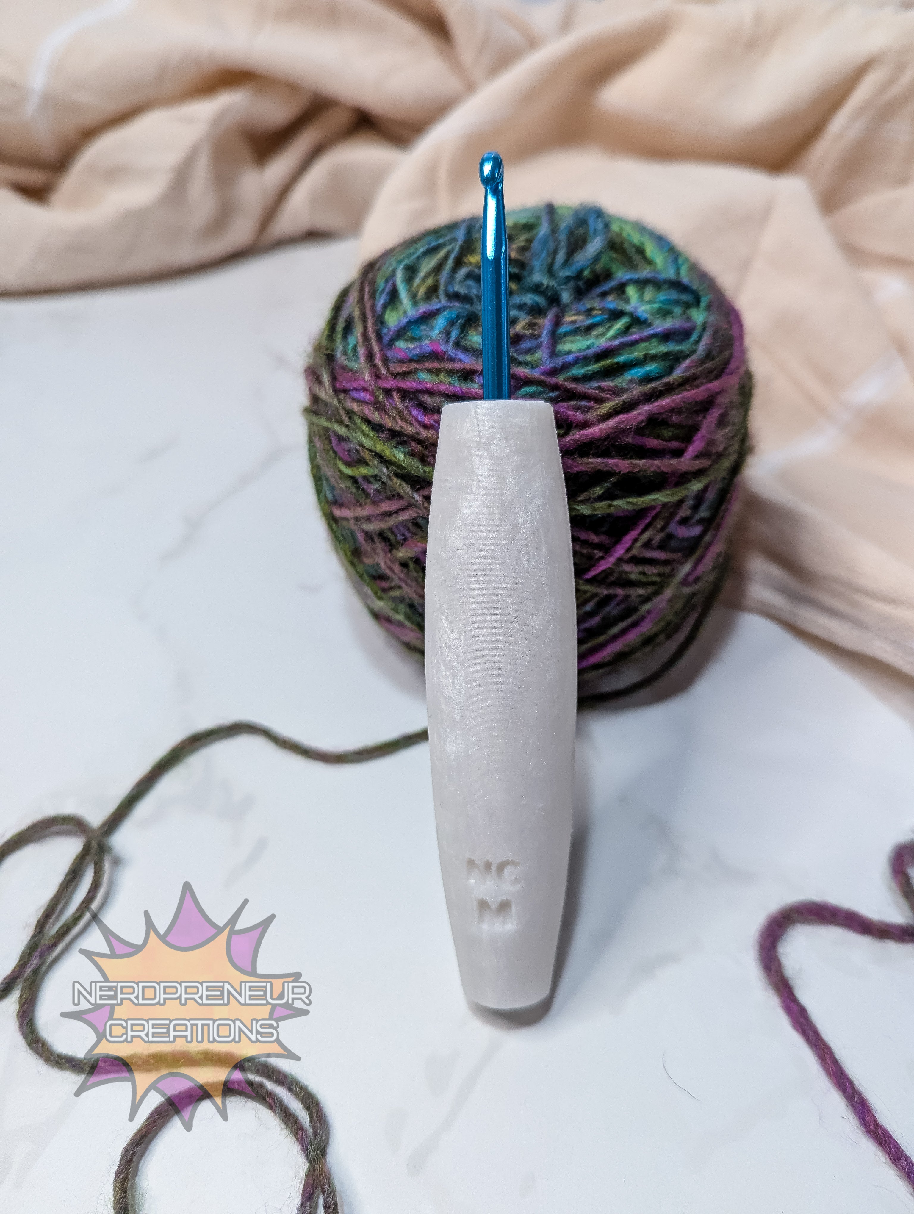 Crochet hook with yarn on a light background