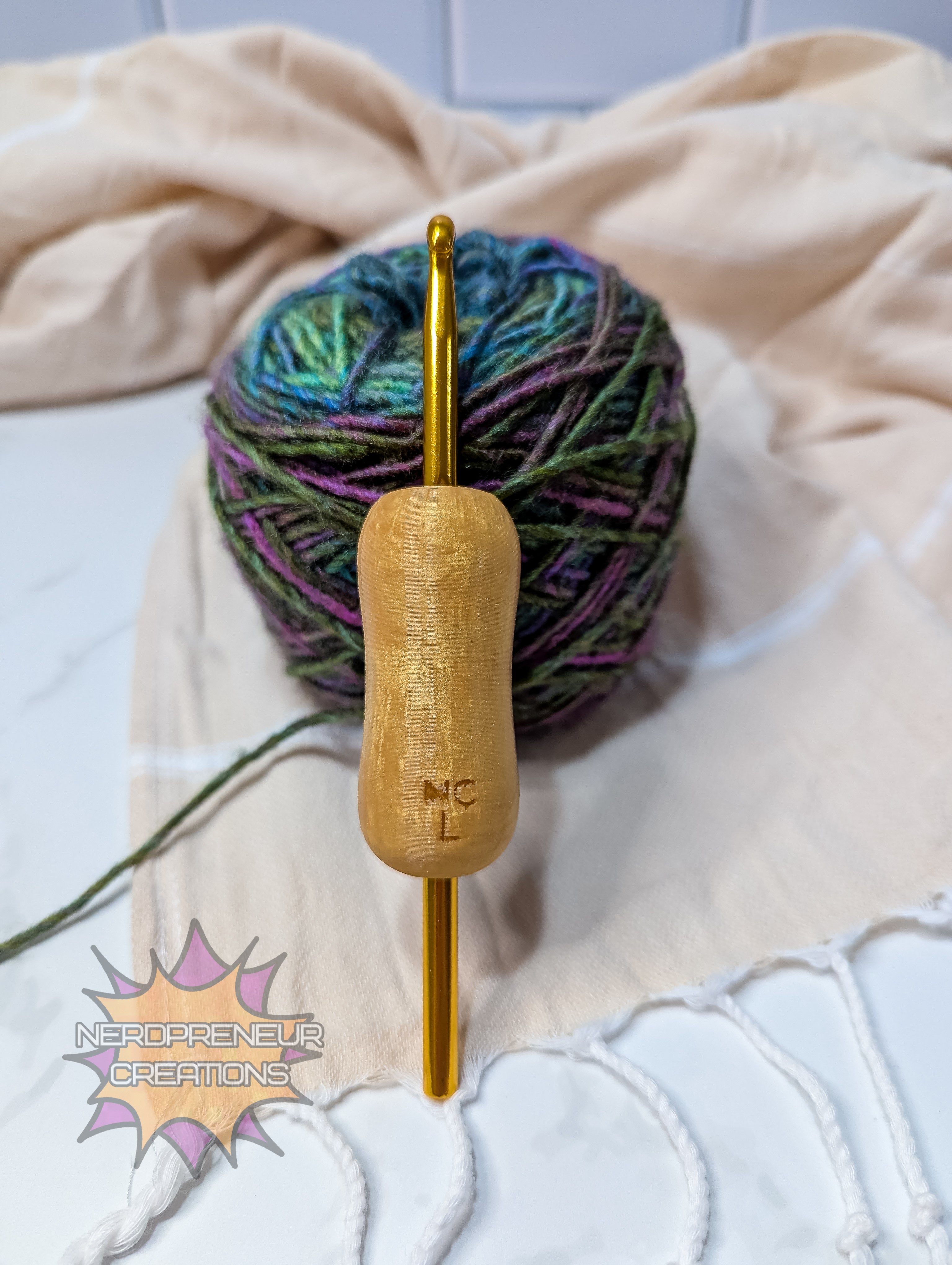 silicone crochet grip with multicolored yarn on a textured fabric background