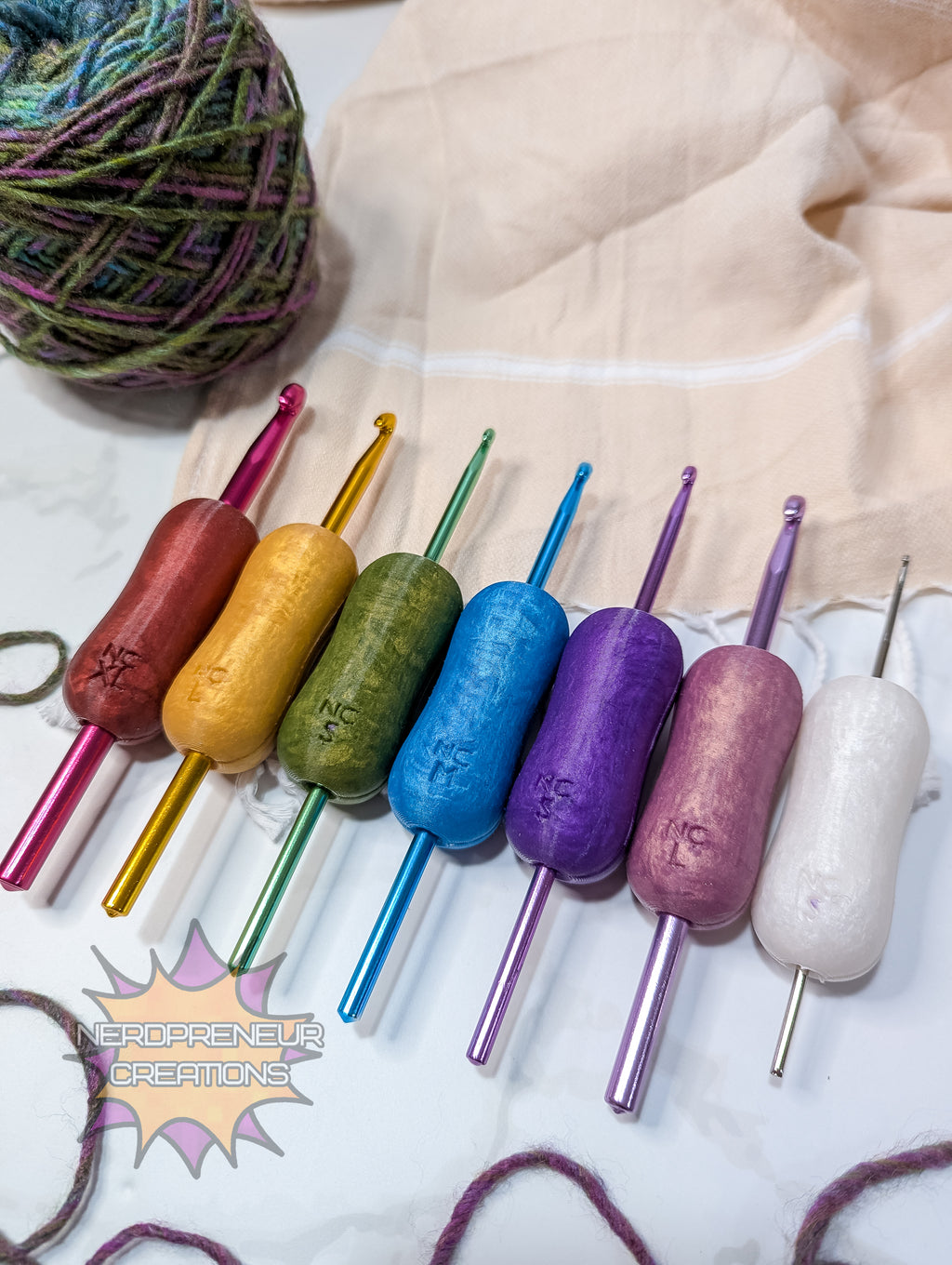 Set of colorful silicone crochet grips on a white surface with yarn in the background.