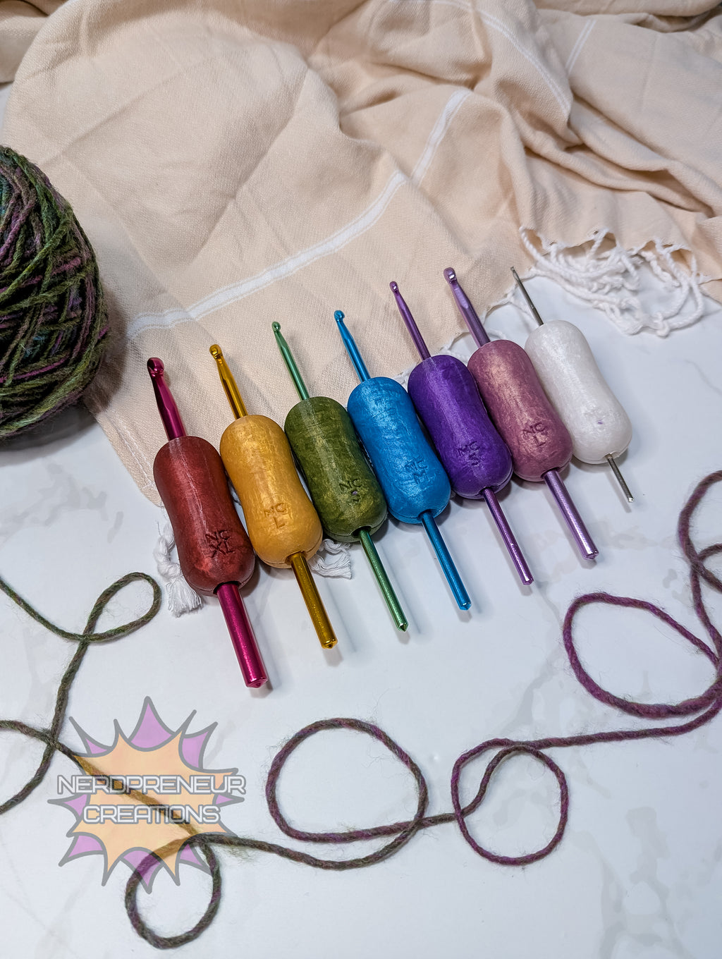 Set of colorful silicone crochet grips on a textured fabric background with 'Nordicpreneur Creations' logo.