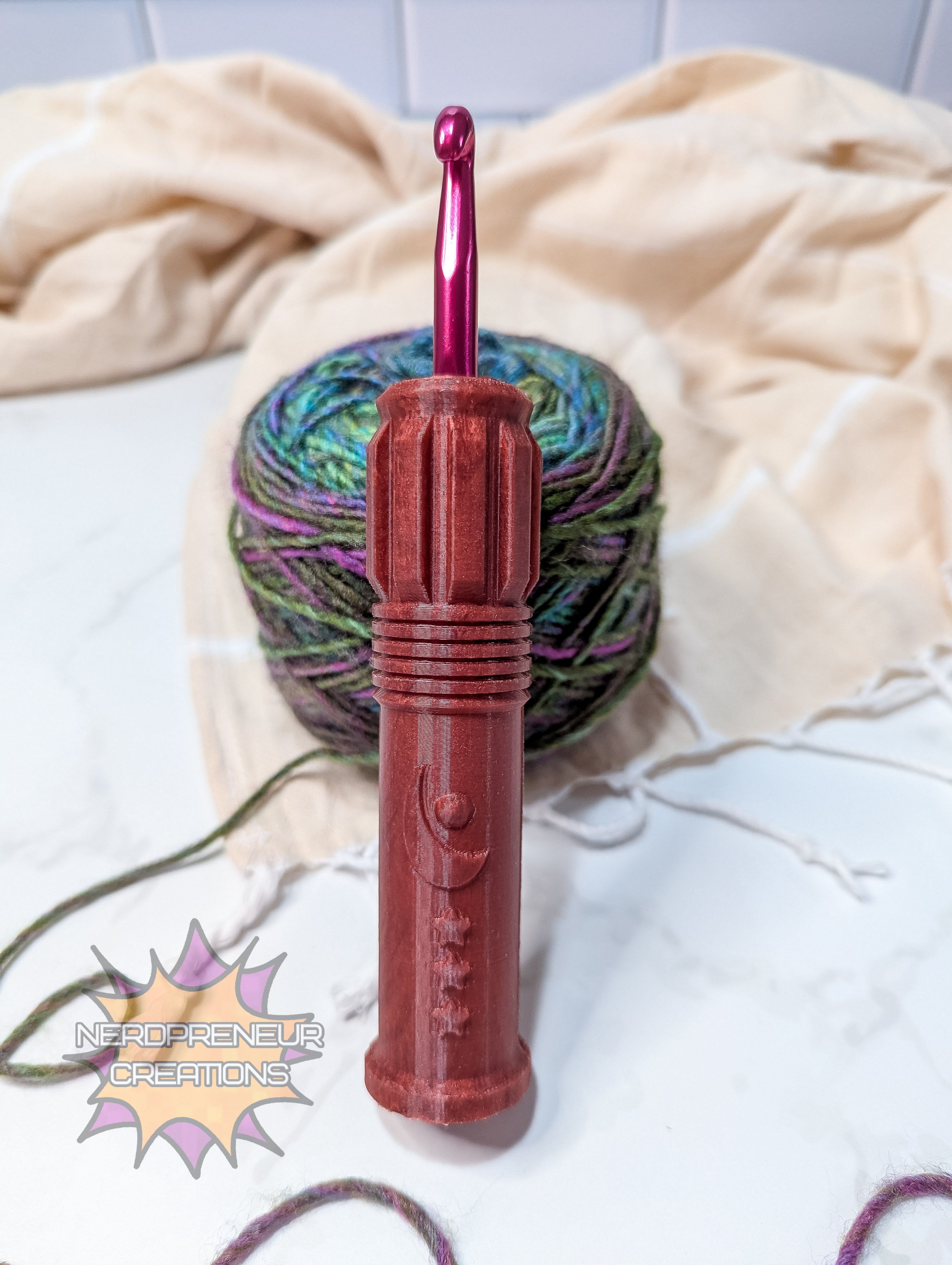 Red silicone crochet grip with a ball of yarn on a white background, featuring 'Nerdpreneur Creations' logo.