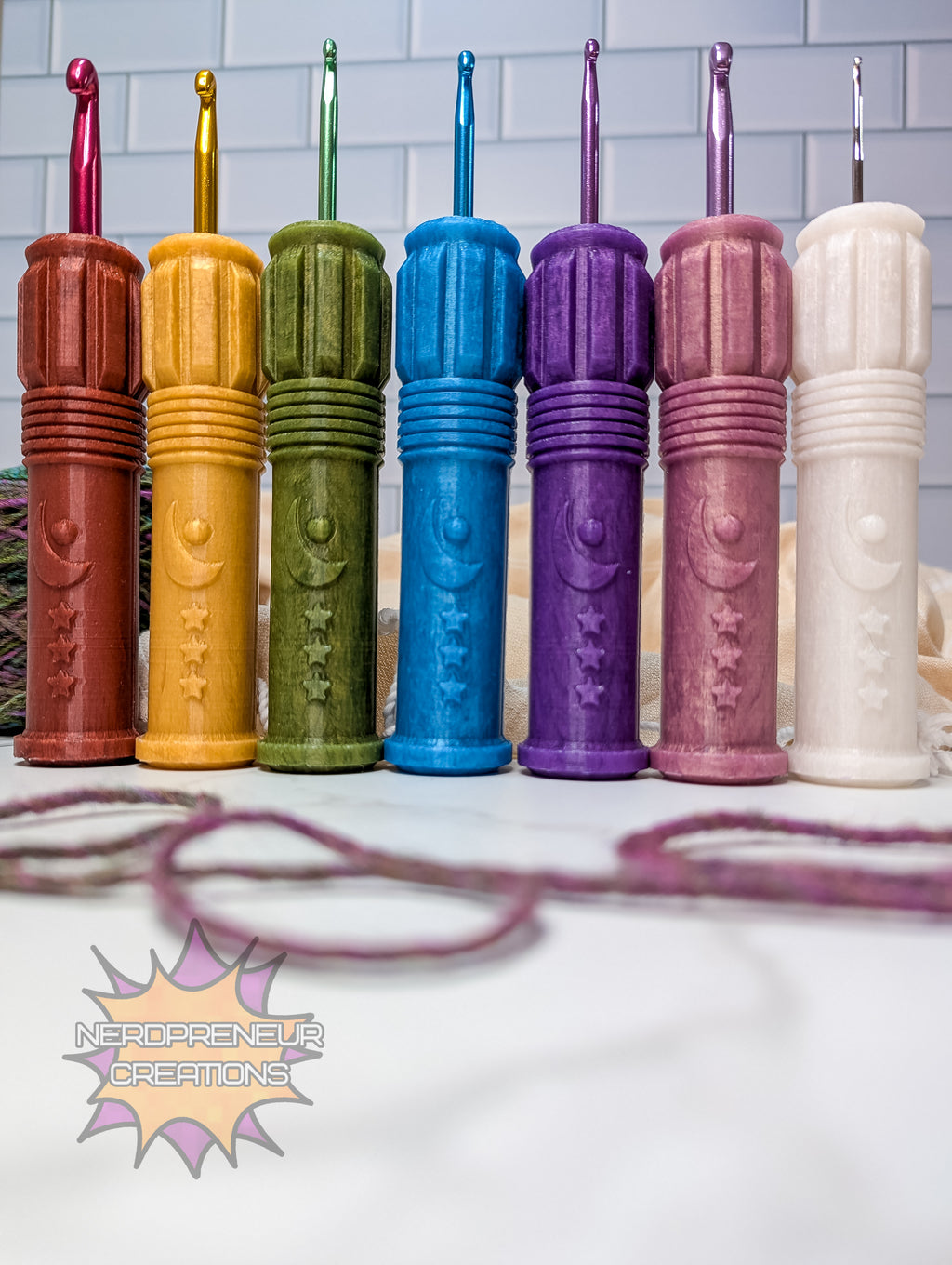 Colorful silicone crochet grips in a row with a visible brand logo.