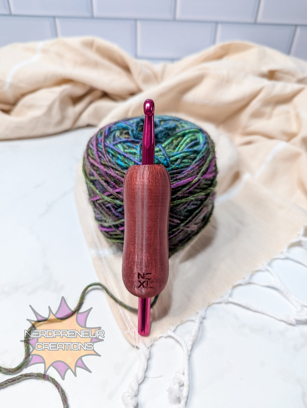 Red silicone crochet grip and colorful yarn on a light background