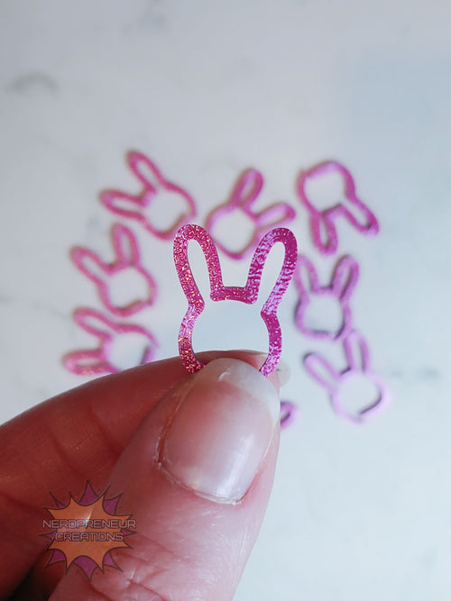 Pink bunny 3D printed stitch markers on a white background